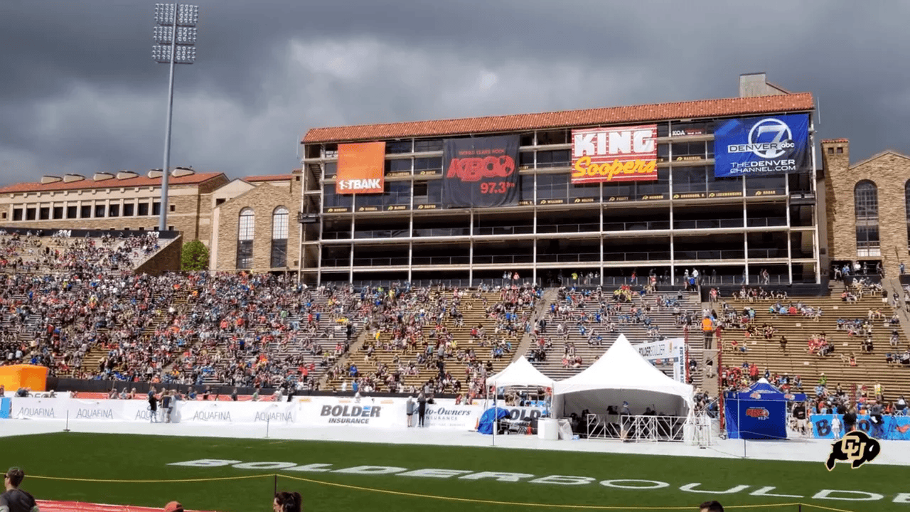 Close view of the natural grass playing surface and spectator seating